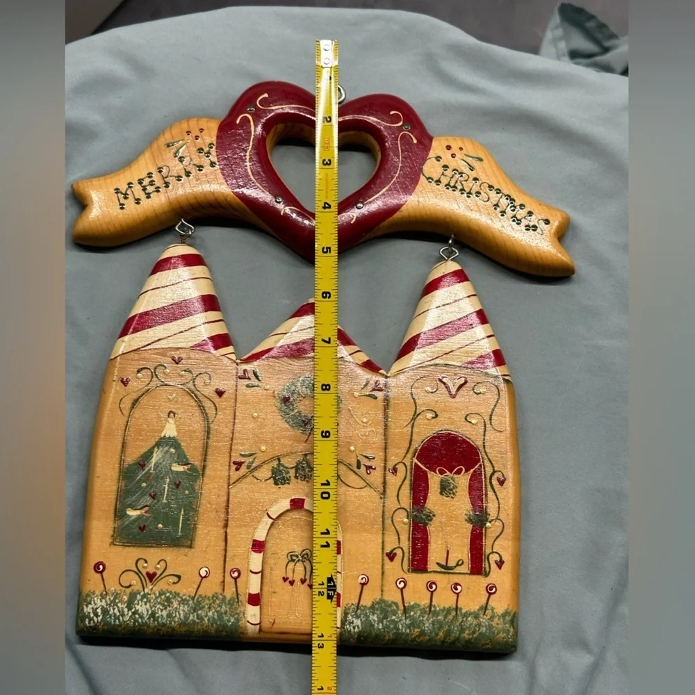 Unique wooden house with Merry Christmas sign handmade in Mexico.